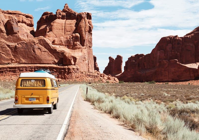 Road-trip moment by the vehicle